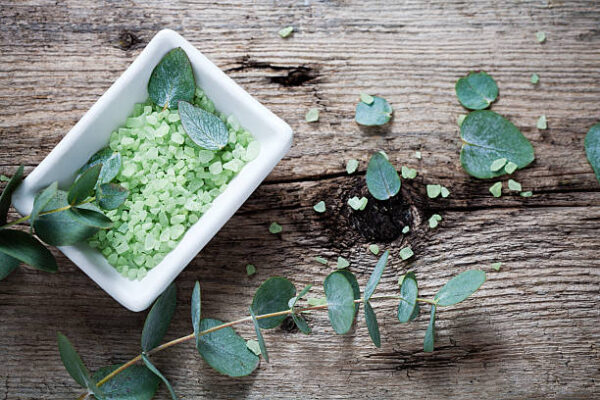 Green bath salt with fresh eucalyptus leaves