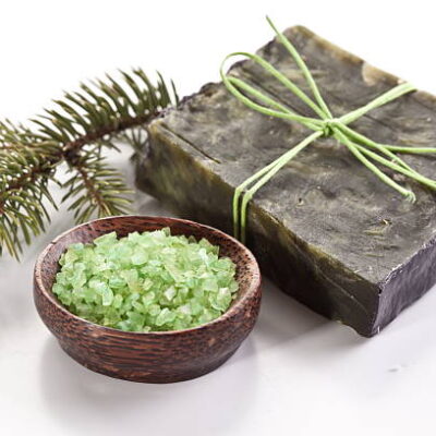 Pine soap with sea salt and branch of pine.