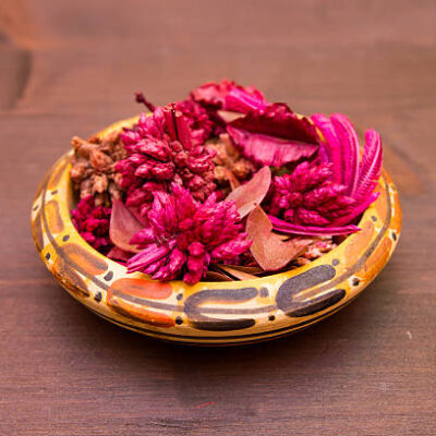 Bowl with pot pourri on a wooden table